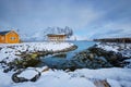 Rorbu house and drying flakes for stockfish cod fish in winter. Lofoten islands, Norway Royalty Free Stock Photo