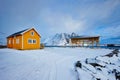 Rorbu house and drying flakes for stockfish cod fish in winter. Lofoten islands, Norway Royalty Free Stock Photo