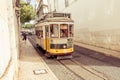 Traditional yellow tram downtown Lisbon