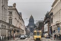 City life and architecture: a traditional yellow tram with the Palais de Justice Law Court of Bruxelles, Zavel neighbourhood