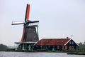 Traditional zaanse schans garden house windmill in The Netherlands. Unique beautiful and wild European city. Royalty Free Stock Photo