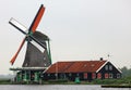 Traditional zaanse schans windmill in The Netherlands. Unique beautiful and wild European city. Royalty Free Stock Photo