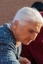 Traditionally dressed old woman shopping at the Nicosia Municipal Wholesale fruit and vegetable market