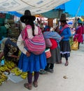 Traditionaly dressed latin american women in the village area