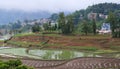 Traditionl Village of hani ethnic people over terraced rice fields in Yuanyang county, Yunnan, China. Yuanyang county lies up to Royalty Free Stock Photo