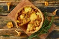 Traditonal swedish cheese and mushroom pie - quiche on the rustic kitchen background decorated with rosemary Royalty Free Stock Photo