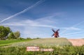 Traebene Mill Windmill with green fields