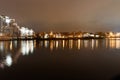Traetskae Pradmestse or Trinity Suburb and Island of Courage and Sorrow or Ostrov Slyoz on Svisloch river bank at night. Minsk. Royalty Free Stock Photo