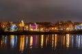 Traetskae Pradmestse or Trinity Suburb and Island of Courage and Sorrow or Ostrov Slyoz on Svisloch river bank at night. Minsk. Royalty Free Stock Photo