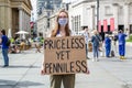 TRAFALGAR SQUARE, LONDON/ENGLAND- 12 September 2020: Protester holding a `Priceless yet penniless` sign