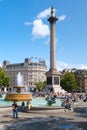 Trafalgar Square and the Nelson Column in London on a sunny day Royalty Free Stock Photo
