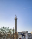 Trafalgar Square, with view of nelson column in early morning time and with tourists around Royalty Free Stock Photo