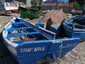 Trafaria, Portugal. March 29, 2023: Traditional small wooden fishing boats from the fishermen of Trafaria village on the Tagus