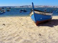 Trafaria, Portugal. March 29, 2023: Traditional small wooden fishing boats from the fishermen of Trafaria village on the Tagus