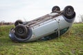 Traffic accident, car after rollover lie on the roof Royalty Free Stock Photo