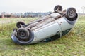 Traffic accident, car after rollover lie on the roof Royalty Free Stock Photo