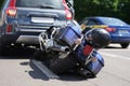 Traffic accident between electric bicycle and car, motorbike fell on asphalt Royalty Free Stock Photo