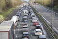 Emergency services closing motorway to attend accident causing a traffic jam