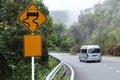 Traffic alerts sign and car driving