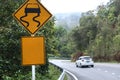 Traffic alerts sign and car driving