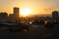 Traffic on an avenue in Havana at sunset. Cuba Royalty Free Stock Photo
