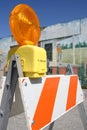 Traffic barricade set against a painted wall