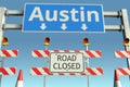 Traffic barricades at Austin city traffic sign. Coronavirus disease quarantine or lockdown in the United States