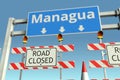 Traffic barricades at Managua city traffic sign. Coronavirus disease quarantine or lockdown in Nicaragua conceptual 3D