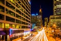 Traffic and buildings on Light Street at night, in downtown Baltimore, Maryland.