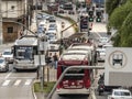 Traffic of buses, cars and pedestrians in Santo Amaro Avenue,