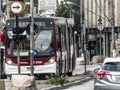 Traffic of buses, cars and pedestrians in Santo Amaro Avenue