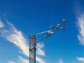 Traffic cameras on top of a pole.
