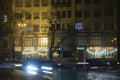 Traffic car lights with residential units and shops at kyiv night