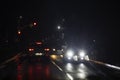 traffic on car wet road at night in bad weather, red light. Blackout in Ukraine, Royalty Free Stock Photo