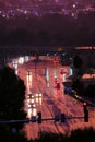 Traffic Driving on Rainy Night on Wet Road with Lights Royalty Free Stock Photo