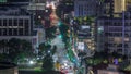 Traffic with cars on a street and urban scene in the central district of Singapore night timelapse Royalty Free Stock Photo