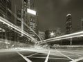 traffic in central district of Hong Kong city at night in monochrome Royalty Free Stock Photo