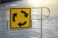 Traffic circle symbol on steel barrier. Royalty Free Stock Photo