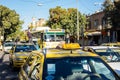 Traffic on city street. Many cars, taxis and bus