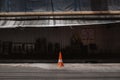 Traffic cone on an empty street in Bangkok, Thailand Royalty Free Stock Photo