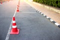 Traffic cone with lines parking on asphalt Royalty Free Stock Photo