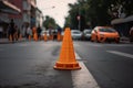 traffic cone in the middle of a crosswalk, warning pedestrians and drivers to stop