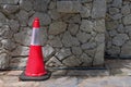 Traffic cone on pathway near the road