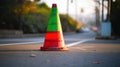 a traffic cone sitting on the side of a road next to a street