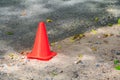 Traffic cone small orange on asphalt with copy space Royalty Free Stock Photo
