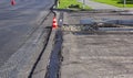 Traffic cone is using during road work. Concrete curb installation Royalty Free Stock Photo