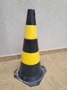 Traffic cones. Black highway traffic cone with yellow stripes. Royalty Free Stock Photo