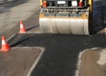 traffic cones and a heavy road roller Royalty Free Stock Photo