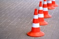 Traffic cones, protective signal plastic orange chips. Road works are carried out in a safe environment Royalty Free Stock Photo