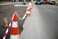 Under construction board sign on the closed road with arrow sign and traffic cone. Royalty Free Stock Photo